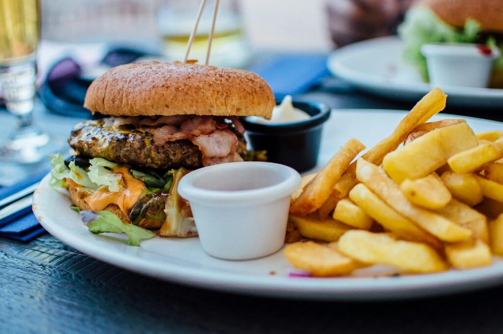 A plate with a burger and fries